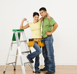 couple painting home interior